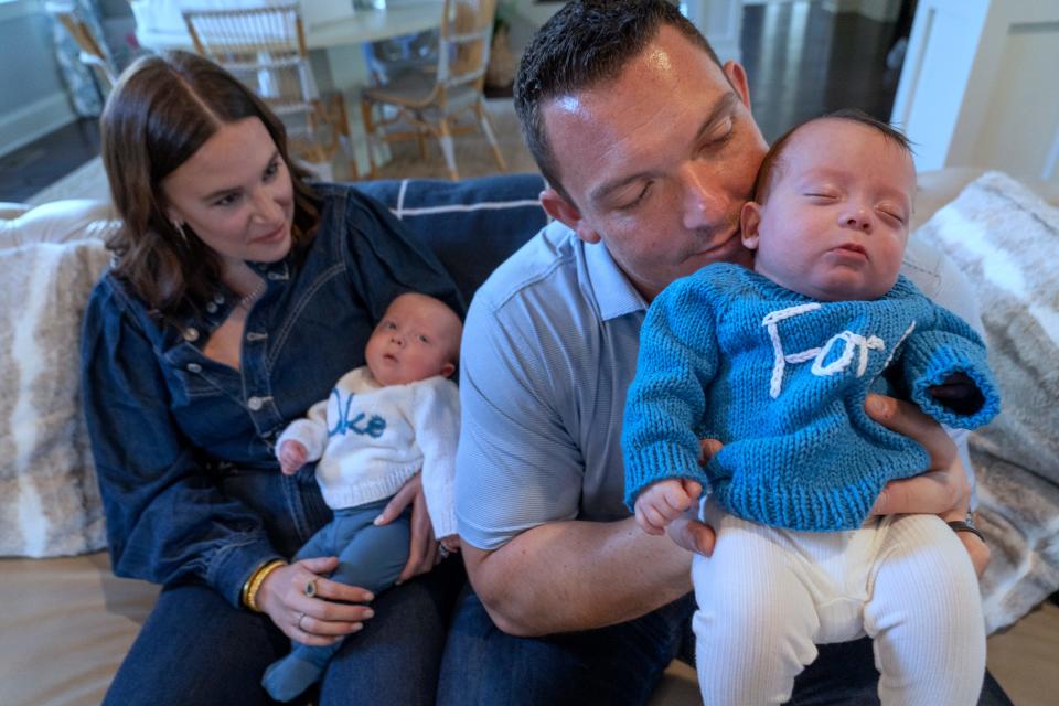Emma Kelly, left, and her husband, Indianapolis Colts center Ryan Kelly, sit with their new sons Duke, left, and Ford, Thursday, Nov. 16, 2023 in their home. When Emma went into preterm labor with the boys at 27 weeks she said, "I was sick to my stomach that I might be losing them."