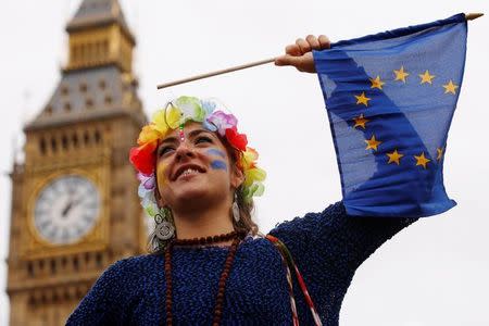 A Pro-Europe demonstrator waves a flag during a "March for Europe" protest against the Brexit vote result earlier in the year, in London, Britain, September 3, 2016. REUTERS/Luke MacGregor