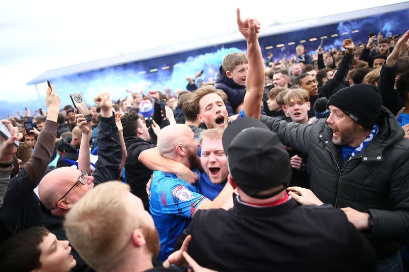 County fans celebrate after their 2-0 victory -Credit:Phil Oldham/REX/Shutterstock