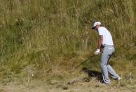 Jun 21, 2015; University Place, WA, USA; Dustin Johnson hits from the rough on the 6th hole in the final round of the 2015 U.S. Open golf tournament at Chambers Bay. Kyle Terada-USA TODAY Sports