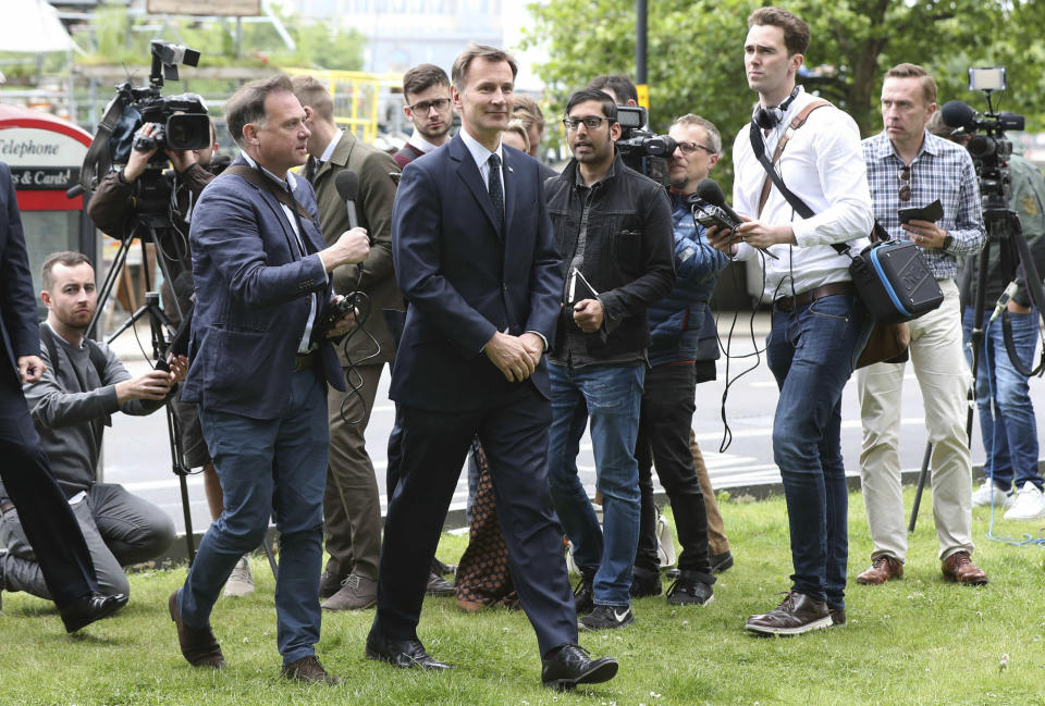 Conservative Party leadership contender Jeremy Hunt arrives for the Conservative National Convention meeting in central London, Saturday June 15, 2019. Britain's Conservative Party is holding elimination votes to reduce the field until the final two contenders will be put to a vote of 160,000 Conservative Party members nationwide, with the winner replacing Theresa May, as party leader and prime minister, with the result due late July. (Yui Mok/PA via AP)