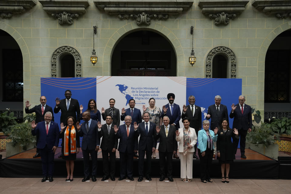 Guatemalan Foreign Minister Carlos Ramiro Martinez Alvarado, front row, fifth from left, and U.S. Secretary of State Antony Blinken, front row, sixth from left, pose for a group photo with other regional representatives at the National Palace in Guatemala City, Tuesday, May 7, 2024. Blinken is in Guatemala for a two-day visit where he will attend a regional meeting on irregular migration. (AP Photo/Moises Castillo)