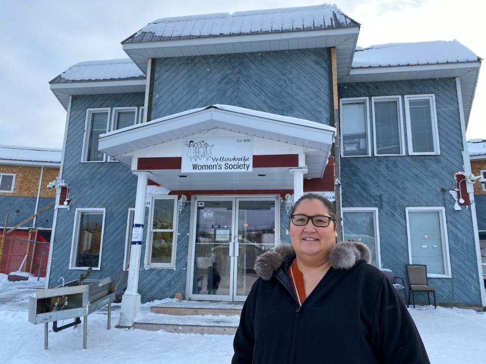 Yellowknife Women's Society executive director Renee Sanderson stands outside the Spruce Bough, supported living program, doors in Yellowknife on Nov. 7, 2022.