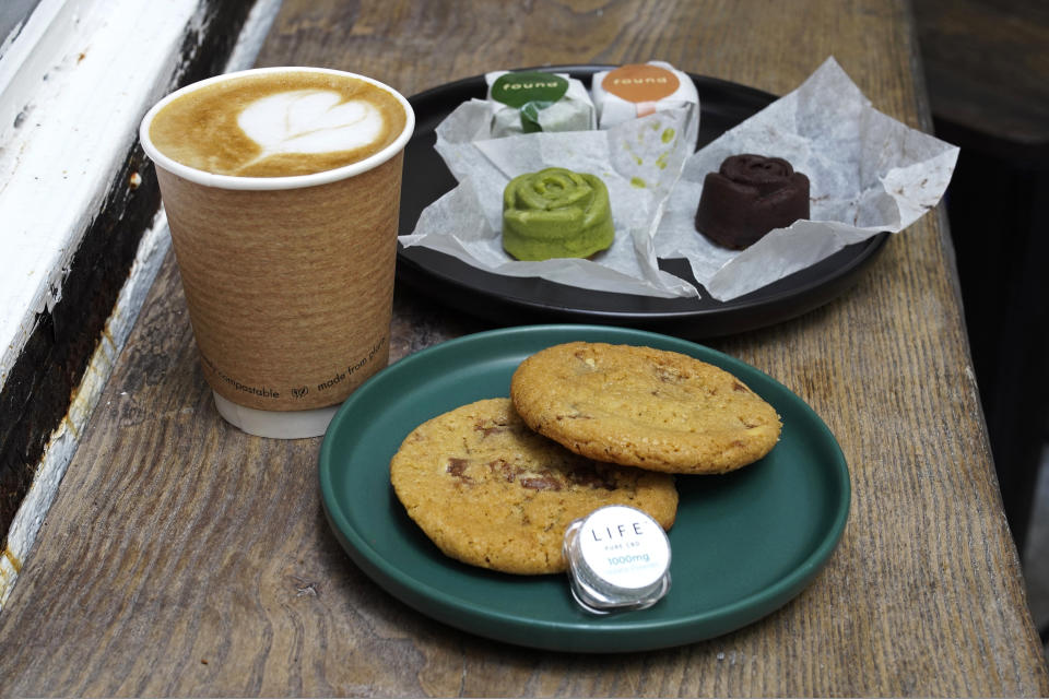 FILE - Coffee, biscuits, green tea and chocolate mooncake that contain cannabidiol, or CBD, a substance from the cannabis plant, are displayed at the Found Cafe in Hong Kong on Sept. 13, 2020.Hong Kong banned cannibidiol, also known as CBD, as a "dangerous drug" and imposed harsh penalties for possession on Wednesday, Feb. 1, 2023, forcing fledging businesses to shut down and revamp. (AP Photo/Vincent Yu, File)