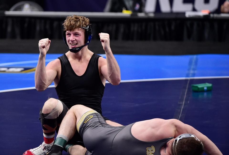 Shane Griffith, shown after he won the 2021 165-pound national championship, got a standing ovation from the crowd at the BOK Center in Tulsa, OK. after he finished fifth at 165 in this year's NCAA Tournament.