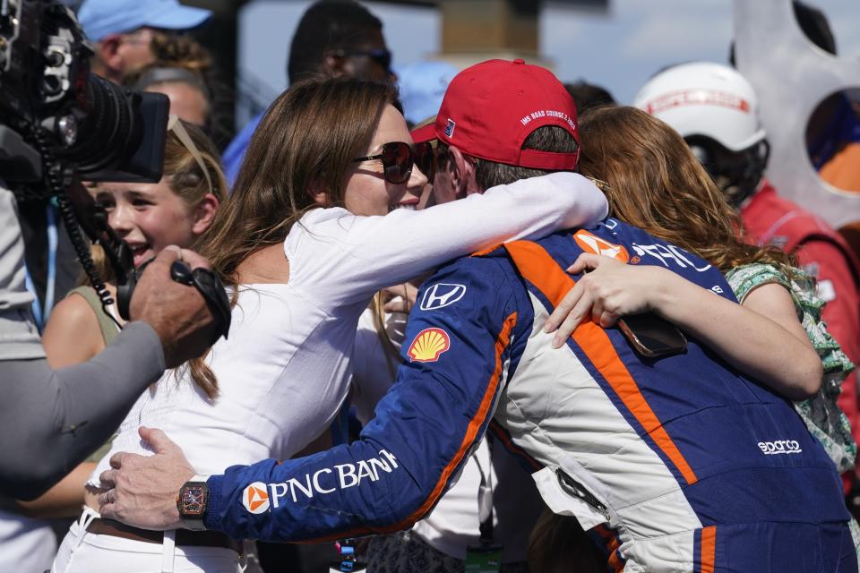 Scott Dixon, of New Zealand, celebrates with is family after winning the IndyCar Indianapolis GP auto race at Indianapolis Motor Speedway, Saturday, Aug. 12, 2023, in Indianapolis. (AP Photo/Darron Cummings)