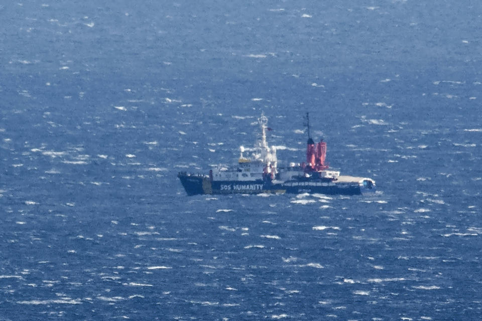 The SOS Humanity 1 rescue ship run by the German organization SOS Humanitarian, is seen at sea off the shores of Sicily, near Aci Reale, southern Italy, Saturday, Nov. 5, 2022. Two German-run migrant rescue ships carrying nearly 300 rescued people are waiting off the eastern coast of Sicily, the Humanity 1 with permission to disembark the most vulnerable migrants while the other's request for a safe port has gone unanswered despite "critical" conditions on board. (AP Photo/Salvatore Cavalli)