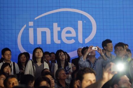 People take pictures in the Intel booth at the Computex 2010 computer fair in Taipei June 1, 2010. REUTERS/Pichi Chuang