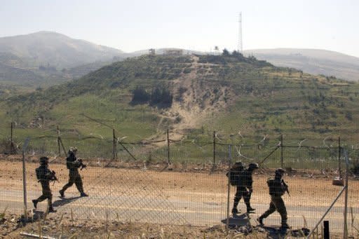 Israeli soliders patrol along the 1967 ceasefire line between the Israeli-occupied Golan Heights and Syria in June 2011. Israel is willing to begin new Middle East peace talks using the 1967 lines as a basis for negotiations if the Palestinians drop their UN membership bid, an Israeli government official confirmed Tuesday