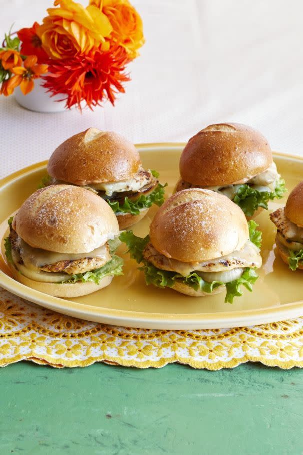 grilled chicken sliders with orange flowerrs in back