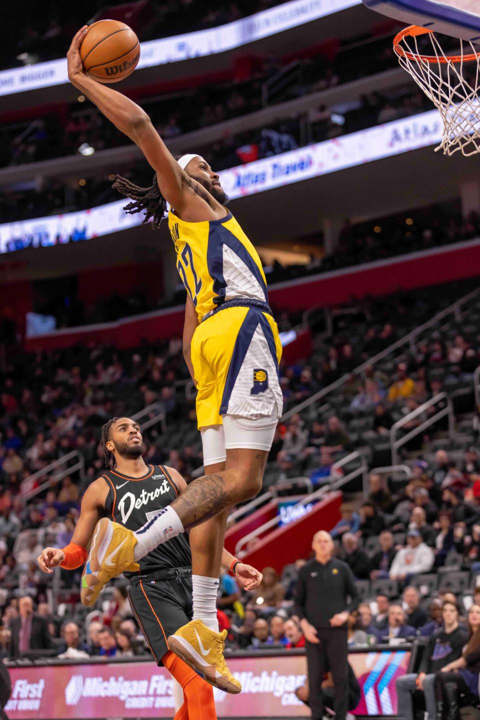 Mar 20, 2024; Detroit, Michigan, USA; Indiana Pacers forward Isaiah Jackson (22) goes up for a slam dunk against the Detroit Pistons in the second half at Little Caesars Arena. Mandatory Credit: David Reginek-USA TODAY Sports