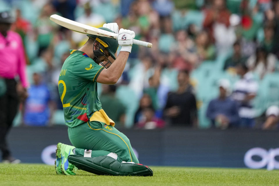 South Africa's Rilee Rossouw celebrates after scoring a century during the T20 World Cup cricket match between South Africa and Bangladesh in Sydney, Australia, Thursday, Oct. 27, 2022. (AP Photo/Rick Rycroft)