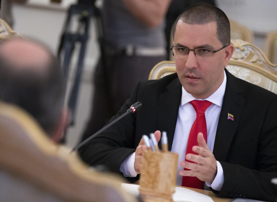 Venezuelan Foreign Minister Jorge Arreaza, right, speaks to Russian Foreign Minister Sergey Lavrov, back to a camera, during their talks in Moscow, Russia, Sunday, May 5, 2019. Lavrov meets with his Venezuelan counterpart on Sunday, a day before Lavrov is to meet the US secretary of state amid growing tensions over the Venezuela crisis. (AP Photo/Alexander Zemlianichenko)