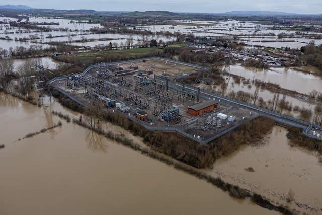 Flood water surrounds a power grid sub-station in Gloucester 