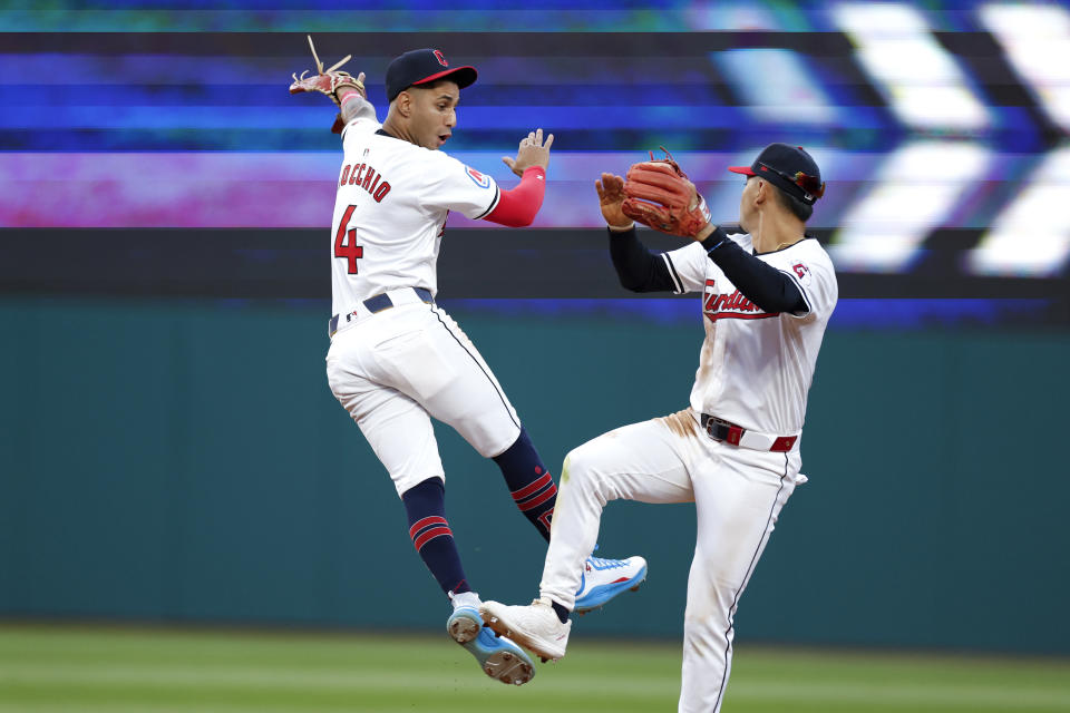 Cleveland Guardians shortstop Brayan Rocchio (4) and second baseman Andrés Giménez celebrate a 4-0 victory over the Chicago White Sox in a baseball game, Monday, April 8, 2024, in Cleveland. (AP Photo/Ron Schwane)