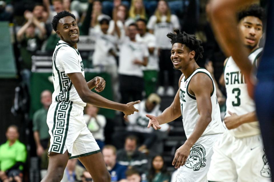 Michigan State's Xavier Booker, left, celebrates his 3-pointer with A.J. Hoggard during the second half in the game against Butler on Friday, Nov. 17, 2023, in East Lansing.