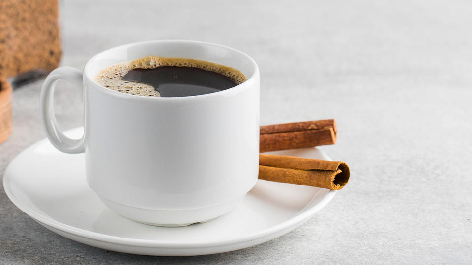 black coffee with cinnamon sticks on saucer; coffee loophole