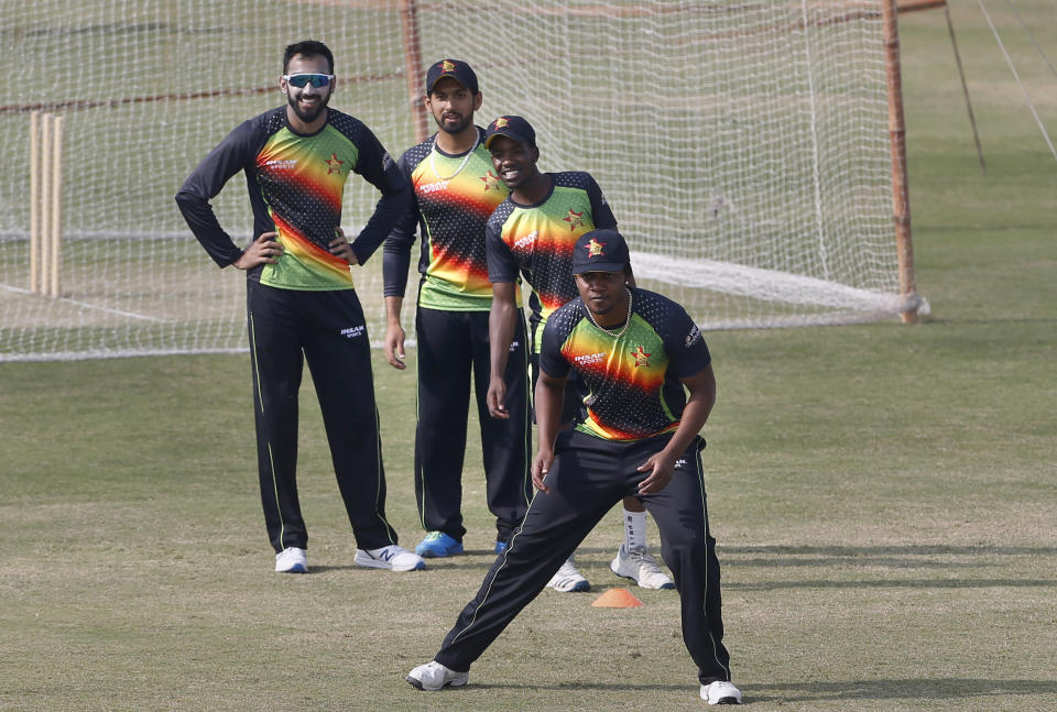 Zimbabwe players Chamu Chibhabha, front to back, Donald Tiripano, Sikandar Raza and Faraz Akram attend a practice session at the Pindi Cricket Stadium, in Rawalpindi, Pakistan, Thursday, Oct. 29, 2020. The Zimbabwe cricket team is in Pakistan to play three ODIs and three Twenty20 International match series, beginning with the first ODI on Friday. (AP Photo/Anjum Naveed)