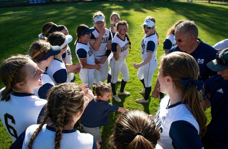 Marist players celebrate their win over the Stayton Eagles Tuesday, May 31, 2022 in the semifinal round of the OSAA Class 4A state tournament at Marist Catholic High School in Eugene. 