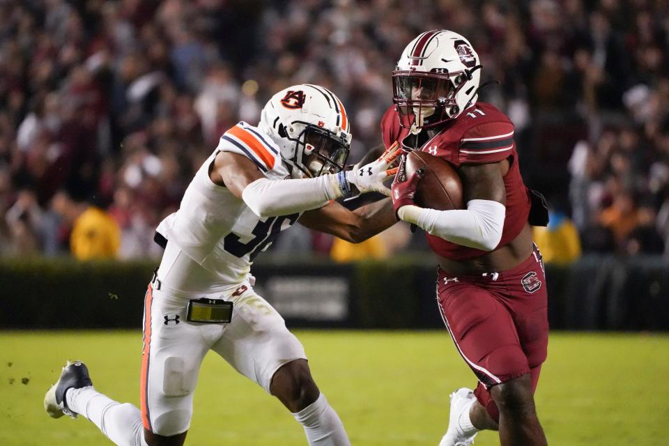 South Carolina running back ZaQuandre White (11) runs with the ball against Auburn cornerback Jaylin Simpson (36) during the first half on Nov. 20 in Columbia, S.C. He is an undrafted free agent signee with the Dolphins.