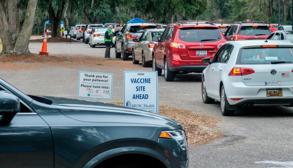 Cars move into lines on Thursday, Jan. 21, 2021 at Beaufort Memorial Hospital’s drive-thru clinic for the Pfizer-BioNTech’s vaccine in the parking lot at Beaufort High School’s stadium. In the first hour and a half hospital staff vaccinated 250 people, according to Deidre Robinson in the hospital’s communications department.