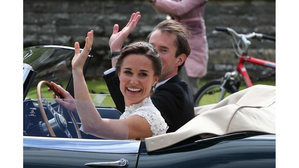 Pippa Middleton and James Matthews waving in the car following their wedding