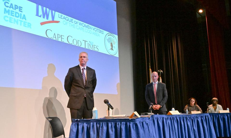 District Attorney candidates Dan Higgins (left) and Rob Galibois stand at the end of the debate at Cape Cod Community College in West Barnstable Wednesday.