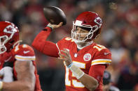 Kansas City Chiefs quarterback Patrick Mahomes (15) throws a pass during the first half of an NFL divisional round playoff football game against the Buffalo Bills, Sunday, Jan. 23, 2022, in Kansas City, Mo. (AP Photo/Charlie Riedel)