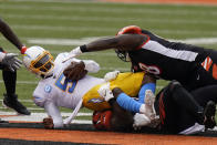 Los Angeles Chargers quarterback Tyrod Taylor (5) is sacked during the first half of an NFL football game against the Cincinnati Bengals, Sunday, Sept. 13, 2020, in Cincinnati. (AP Photo/Bryan Woolston)