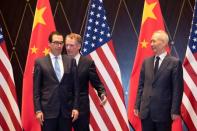 U.S. Trade Representative Robert Lighthizer, Chinese Vice Premier Liu He and U.S. Treasury Secretary Steven Mnuchin take their position for a family photo at the Xijiao Conference Center in Shanghai