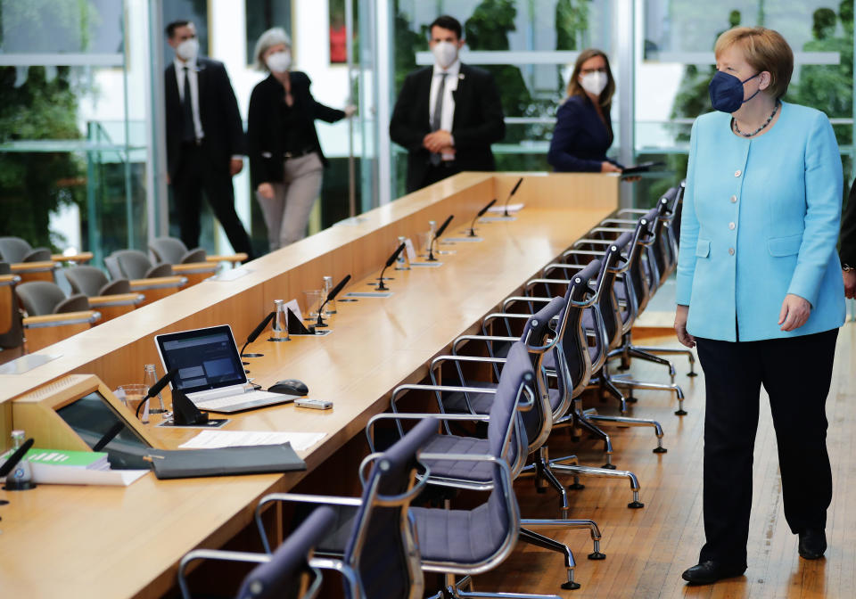 German Chancellor Angela Merkel arrives to hold her annual summer news conference in Berlin, Germany, Thursday, July 22, 2021. (Hannibal Hanschke/Pool Photo via AP)