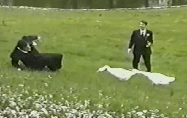 A groomsman being chased by an angry goose.