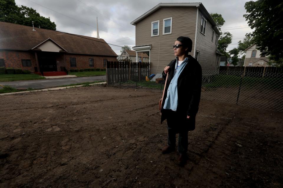 Veronica Hemphill-Nichols, 57, stands on an empty lot where her home of 16 years once stood in the Fruit Belt neighborhood of Buffalo, N.Y. May 16, 2022. The Fruit Belt neighborhood, located on the east side of the city, is a residential neighborhood that has been home to many of Buffalo's Black residents for generations.