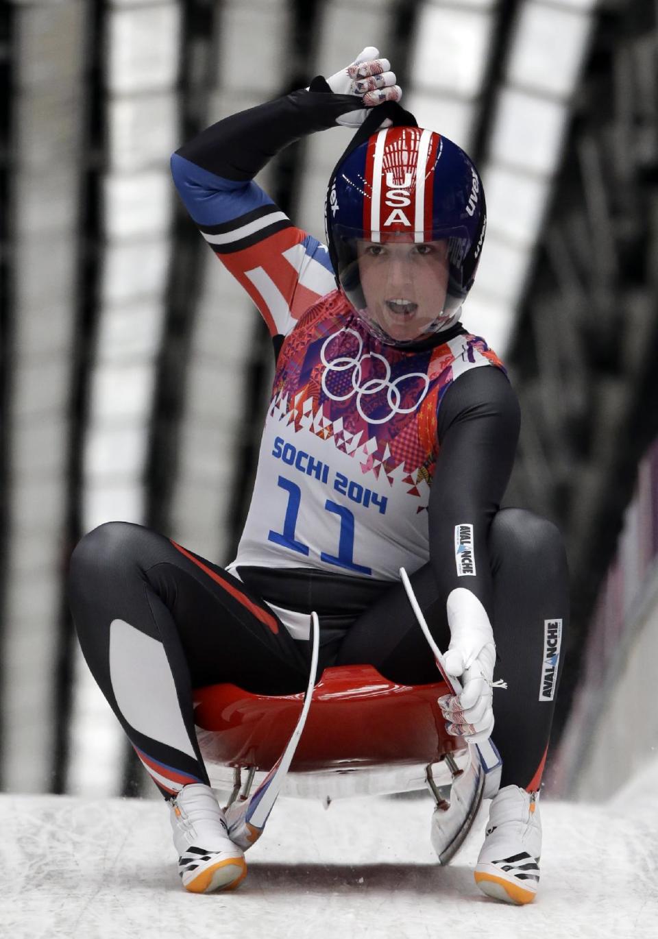 Erin Hamlin of the United States brakes in the finish area after finishing her first run during the women's singles luge competition at the 2014 Winter Olympics, Monday, Feb. 10, 2014, in Krasnaya Polyana, Russia. (AP Photo/Dita Alangkara)