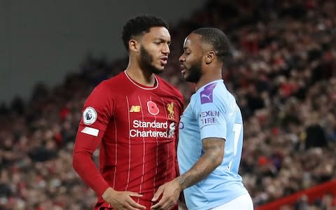 Raheem Sterling squares up to Joe Gomez during Liverpool's win over City at Anfield - Credit: REUTERS