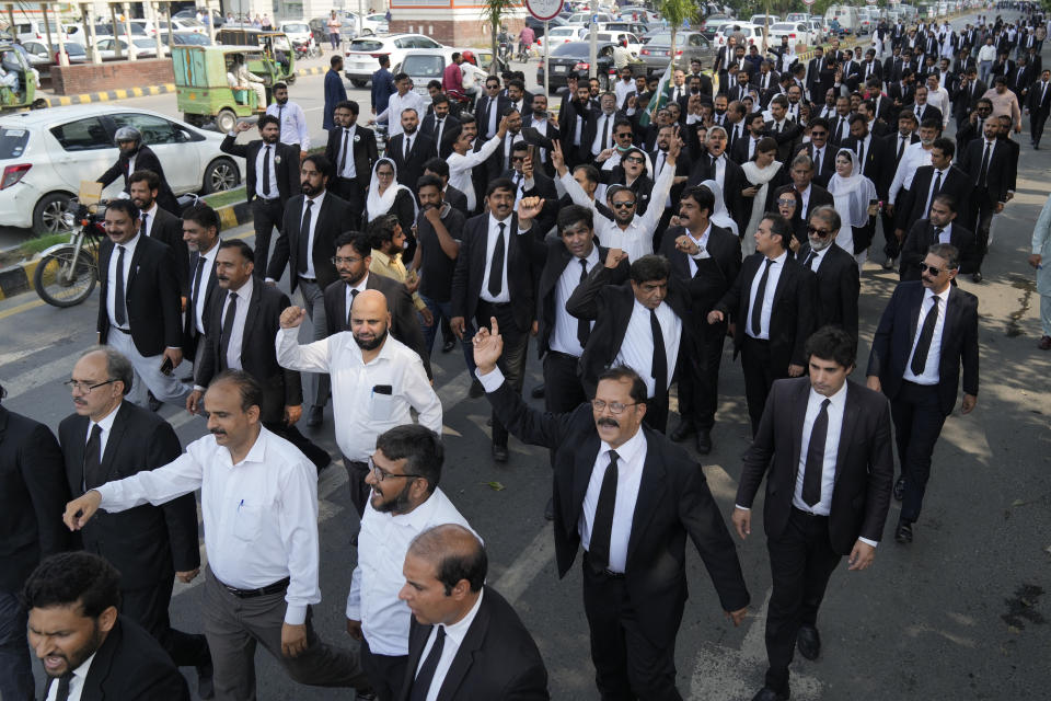 Lawyers participate in a rally against the recent increase in electricity and fuel prices and demanding the announcement of parliamentary election, in Lahore, Pakistan, Thursday, Sept. 21, 2023. Pakistan's election oversight body announced on Thursday that it will hold the next parliamentary elections in the last week of January, delaying the vote which was to be held in November under the constitution. (AP Photo/K.M. Chaudary)