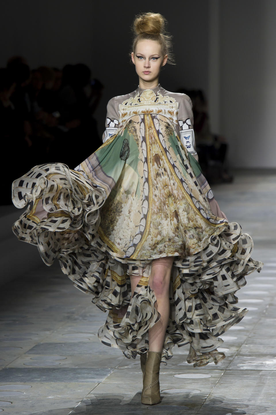 A model displays a creation by designer Mary Katrantzou during a fashion show at London Fashion Week, Tuesday, Feb. 21, 2012. (AP Photo/Jonathan Short)