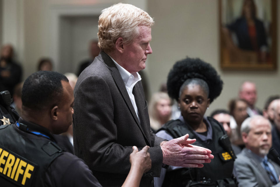 Alex Murdaugh, center, is handcuffed in the courtroom after a guilty verdict in his murder trial was read at Colleton County Courthouse in Walterboro, S.C., Thursday, March 2, 2023. Murdaugh was found guilty on two counts of murder in the shooting deaths in June 2021 of his wife and son. (Joshua Boucher/The State via AP, Pool)