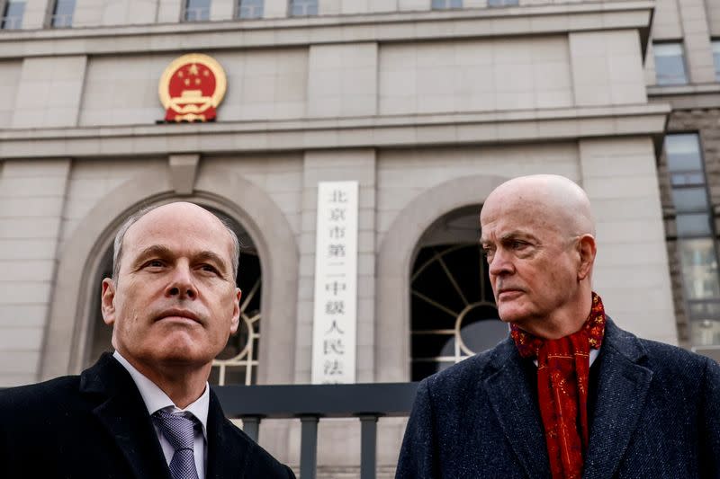 Klein, acting deputy chief of mission of the U.S. Embassy in Beijing, and Nickel, charge d'affaires of the Canadian Embassy in Beijing, stand outside Beijing No. 2 Intermediate People's Court