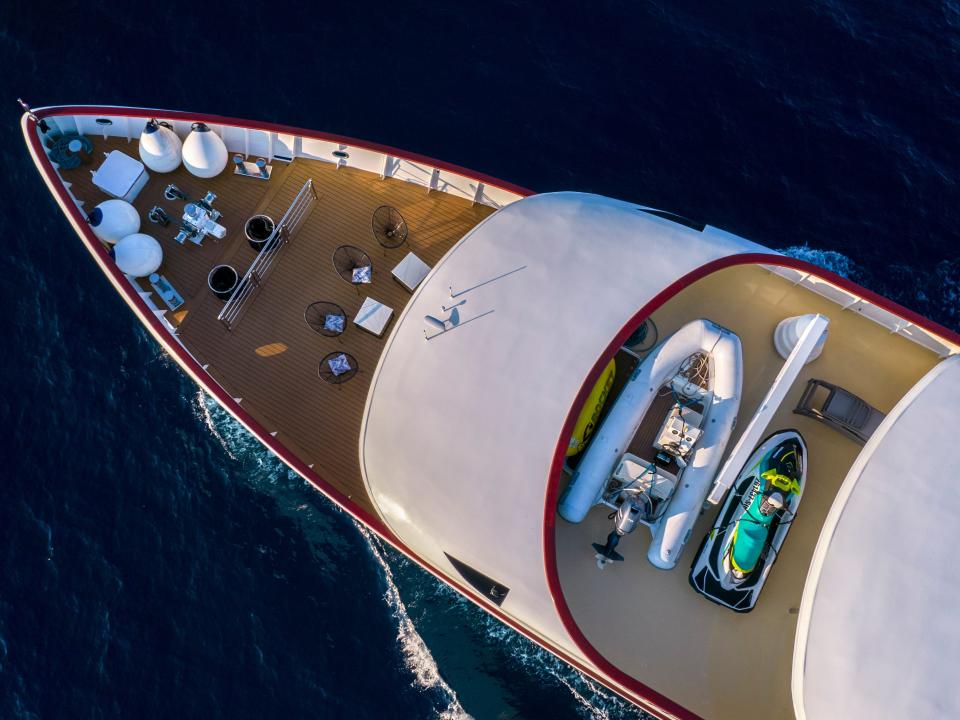 View of the dinghy and jet ski on the top deck of the boat.