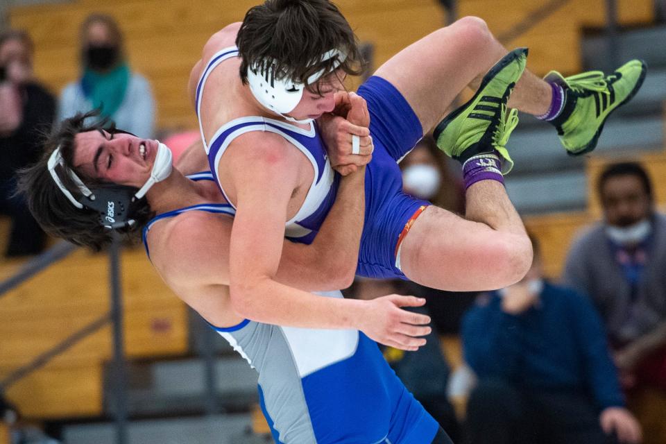 Fort Collins' Jayce Conner wrestles Poudre High School's Henry Ciardullo in the 152-pound weight class during a wrestling dual Thursday at Fort Collins High School.