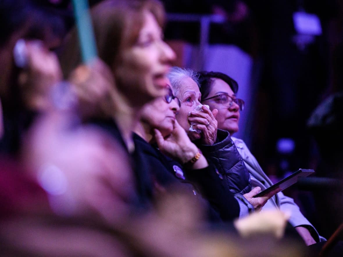 People grieve during a ceremony marking the third anniversary of the downing of Flight PS752 in Toronto on Sunday. (Christopher Katsarov/The Canadian Press - image credit)