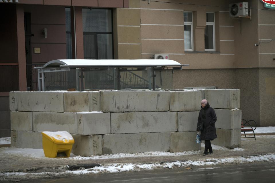 A woman walks past a bus stop in Belgorod, Russia, on Thursday, Jan. 25, 2024. Hundreds of bus stops in the city near the border with Ukraine have been reinforced with blocks of concrete and sandbags to protect them from rocket strikes following the Dec. 30 attack on the city that killed 25 and injured 109. Attacks like those on Belgorod are dealing a heavy blow to President Vladimir Putin’s attempts to reassure Russians that life in the country is largely untouched by the nearly 2-year-old conflict. (AP Photo)