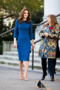 <p>For a trip to the Imperial War Museum on October 31, the Duchess of Cambridge wore a royal blue midi dress by Jenny Packham. <em>[Photo: Getty]</em> </p>