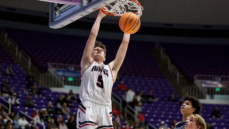 Alta’s Jaxon Johnson dunks while playing Springville in a 5A boys basketball state quarterfinal game at the Dee Events Center in Ogden on March 1, 2023.