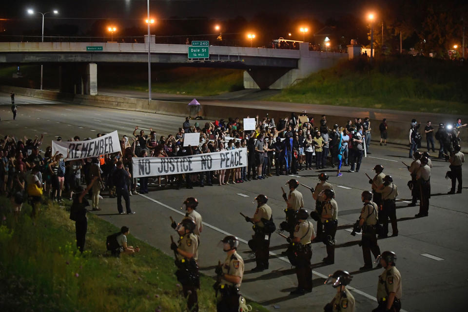 <p>Police and demonstrators stand on Interstate 94 on Friday night, June 16, 2017, in St. Paul, Minn. A Minnesota police officer, Jeronimo Yanez, was cleared Friday in the fatal shooting of Philando Castile, a black motorist whose death captured national attention when his girlfriend streamed the grim aftermath on Facebook (Aaron Lavinsky/Star Tribune via AP) </p>