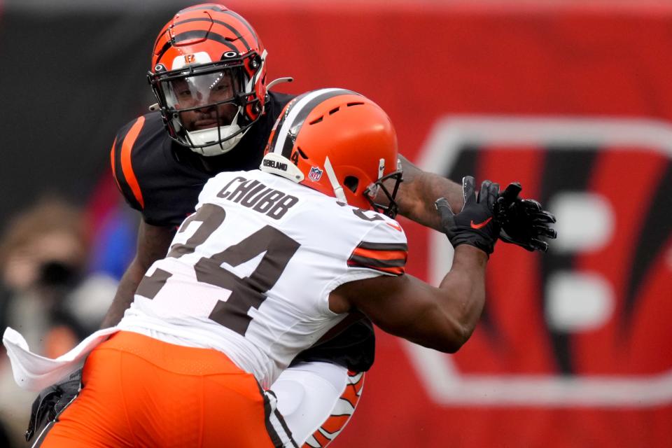 Cincinnati Bengals linebacker Germaine Pratt (57) tackles Cleveland Browns running back Nick Chubb (24) in the first quarter during a Week 14 NFL game, Sunday, Dec. 11, 2022, at Paycor Stadium in Cincinnati. Mandatory Credit: Kareem Elgazzar-The Cincinnati Enquirer-USA TODAY Sports