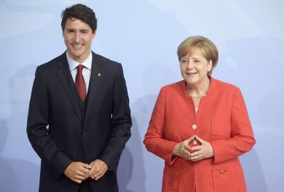 Angela Merkel (R) welcoming Canadian Prime Minister Justin Trudeau.
