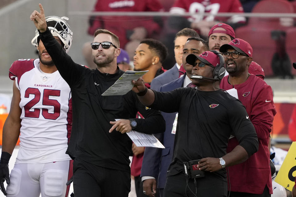 Arizona Cardinals head coach Kliff Kingsbury, second from left, and defensive coordinator Vance Joseph, foreground right, gesture from the sideline during the second half of an NFL football game against the San Francisco 49ers in Santa Clara, Calif., Sunday, Nov. 7, 2021. (AP Photo/Tony Avelar)