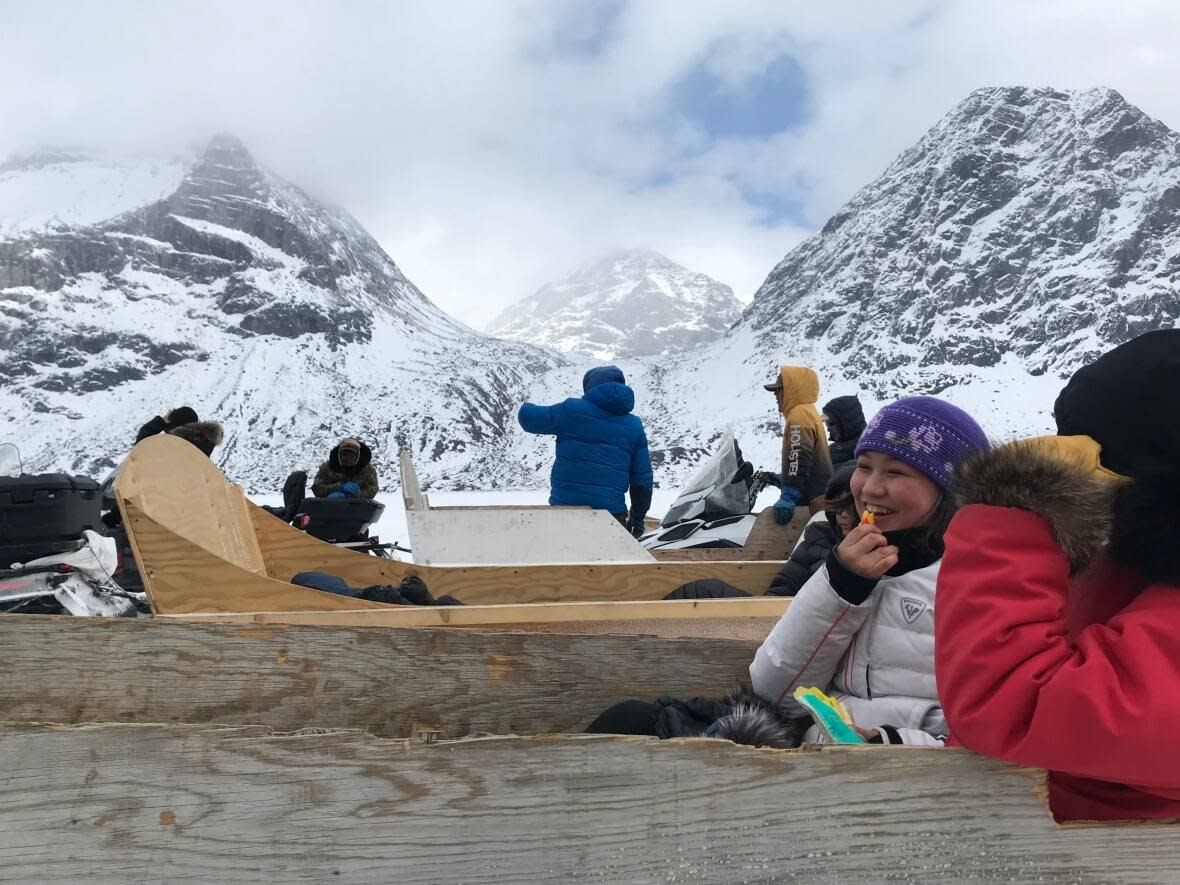 The Ottawa Inuit youth group went through the mountains of Pangnirtung on skidoos during their trip to Nunavut. (Submitted by Daniel Fyfe - image credit)